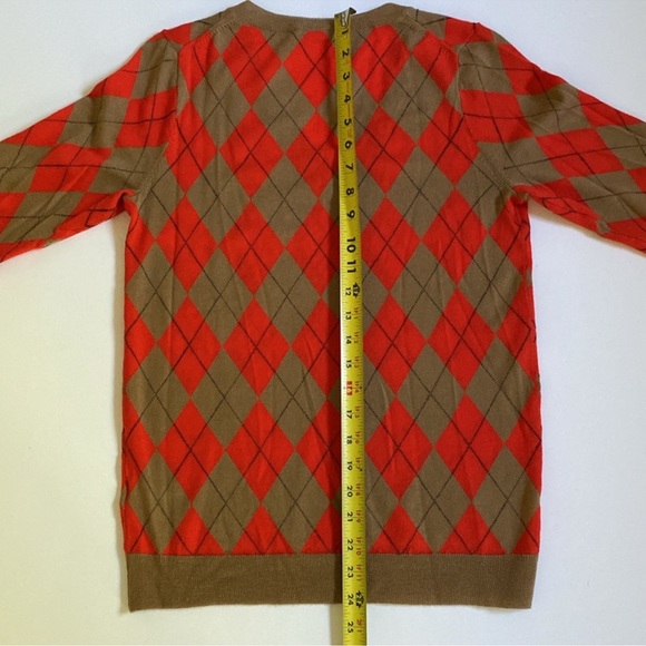 J Crew
Women’s 
Wool 
Medium 
V-Neck Argyle Sweater
Tan and Orange 
EUC - Picture 5 of 11
